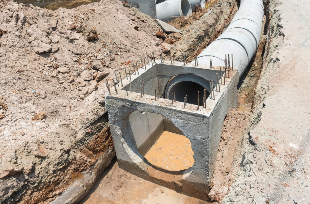 Concrete drainage pipre row on the conctruction work.