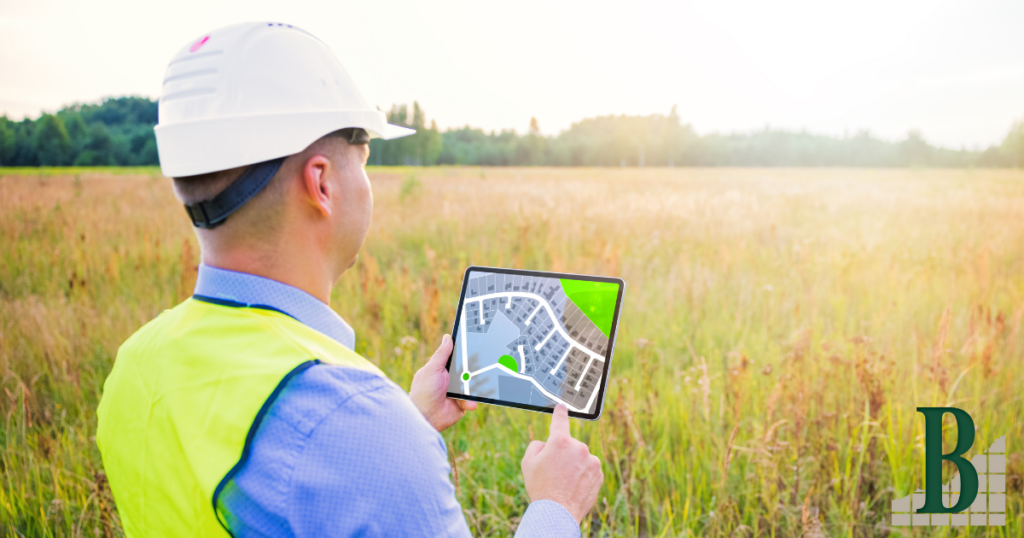 A land surveyor using technology to ensure accurate land surveying for a land development project.