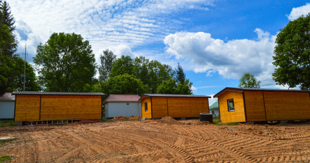 Buildings constructed on dirt ground.